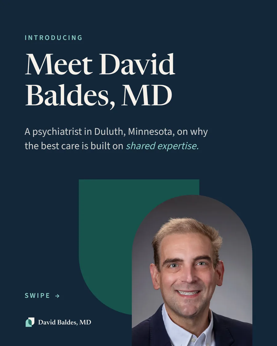 Cover slide on a navy background. Text: "Introducing. Meet David Baldes, MD. A psychiatrist in Duluth, Minnesota, on why the best care is built on shared expertise." A smiling portrait of Dr. Baldes in a navy blazer and white shirt, framed in an arch shape, overlaps a green U-shaped arch. "Swipe" prompt and the David Baldes, MD logo.